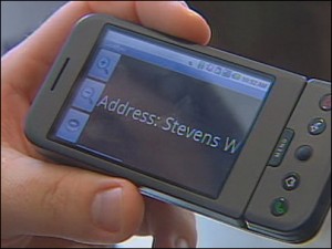 a hand holding an Android phone horizontally with the text Address: Stevens W on the screen in large print